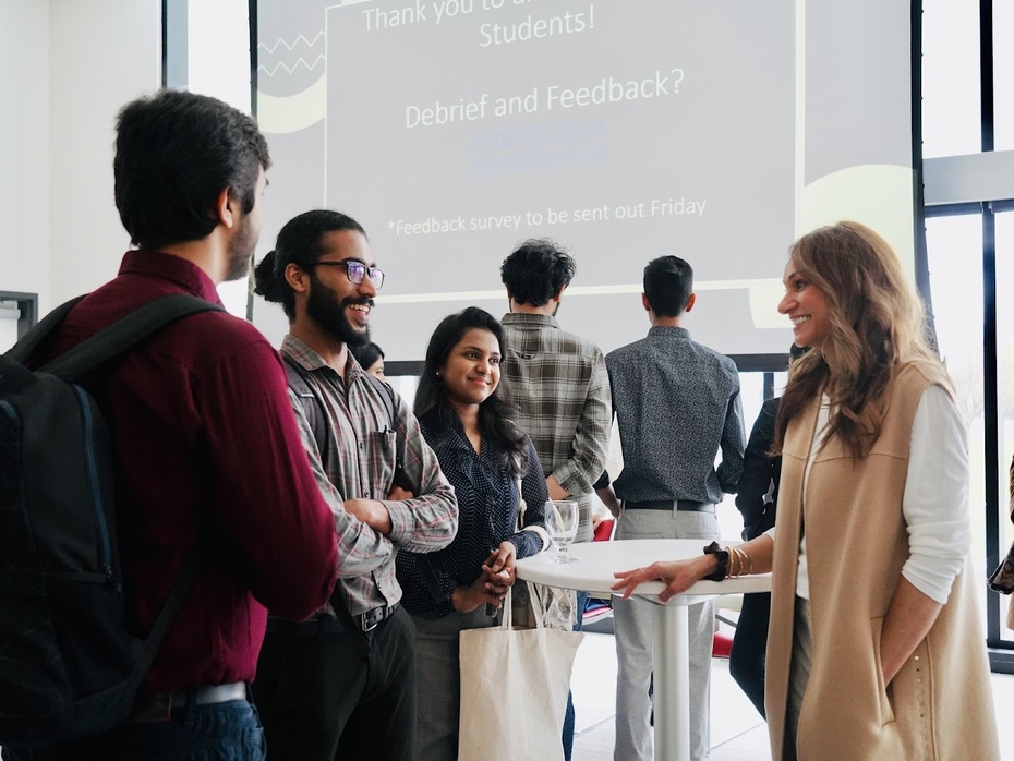 Students talk with HCA professor Ekta Singh at the HCA Career Networking Fair
